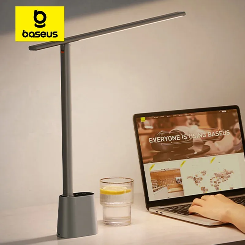 Baseus slim desk lamp beside a laptop